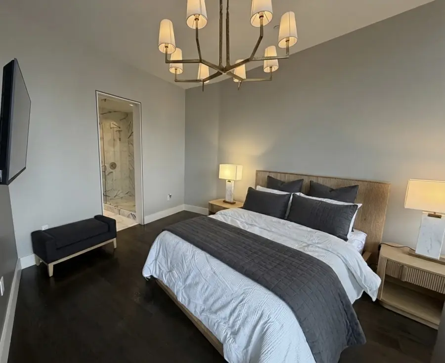 Finished bedroom with warm wood and grey palette